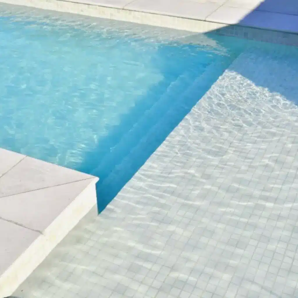 Modern pool with white glass mosaic tiles
